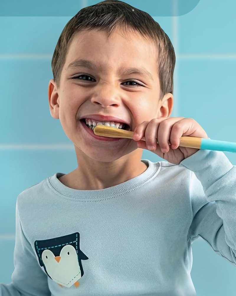 A child brushing and smiling